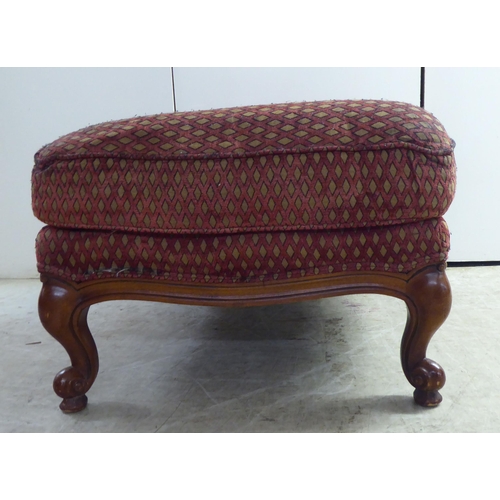 256 - A modern diamond formation pattern fabric upholstered footstool, raised on cabriole legs 