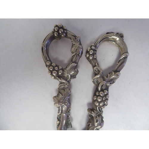 36 - A pair of Victorian silver grape scissors  George W Adams  London  (date letter obscu... 