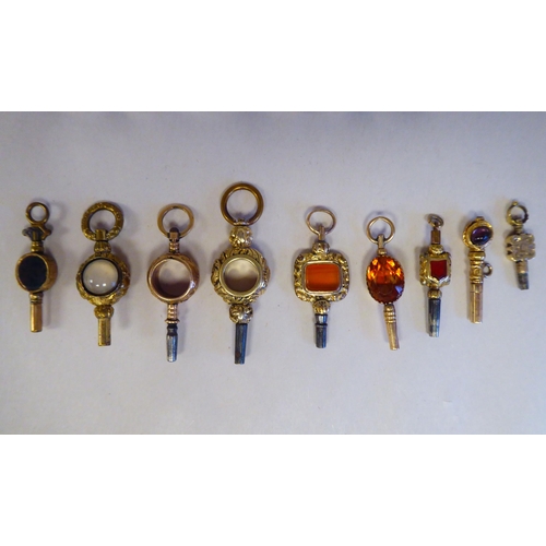 4 - Eighteen antique and variously decorated 9ct and 15ct gold and yellow metal watch keys, pendant fob ... 