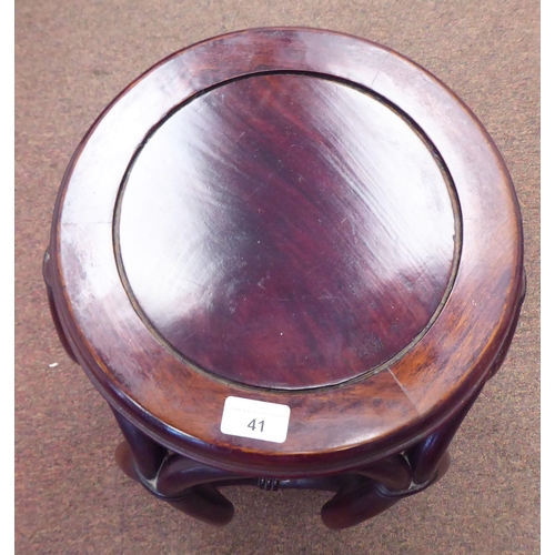 41 - A 20thC Oriental mahogany framed open barrel design stool with simulated bamboo supports