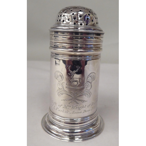 46 - A George III silver cylindrical sander with a perforated cover and loop handle  bears a contemp... 