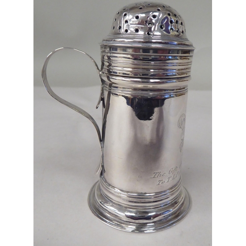 46 - A George III silver cylindrical sander with a perforated cover and loop handle  bears a contemp... 