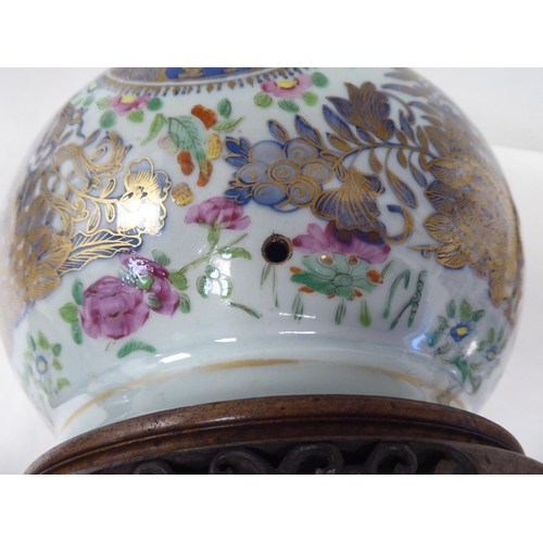 48 - An early 20thC Chinese porcelain bottle vase design table lamp, decorated in colours and gilding wit... 