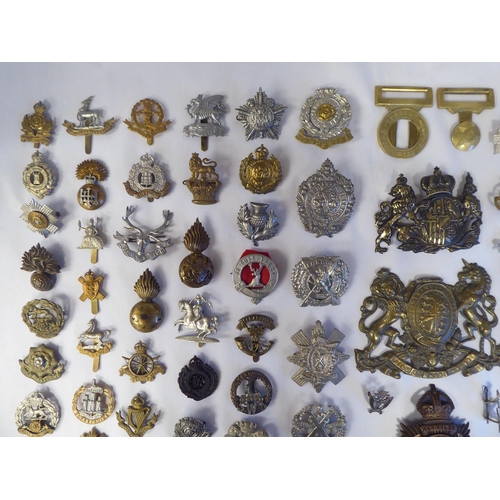 58 - Approx. fifty-five military cap badges and other insignia, some copies: to include Lowland Regiment;... 