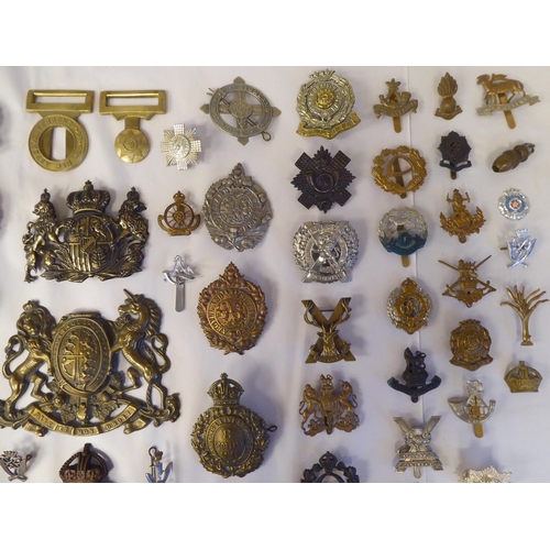 58 - Approx. fifty-five military cap badges and other insignia, some copies: to include Lowland Regiment;... 