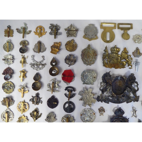 58 - Approx. fifty-five military cap badges and other insignia, some copies: to include Lowland Regiment;... 