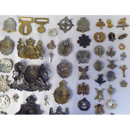 58 - Approx. fifty-five military cap badges and other insignia, some copies: to include Lowland Regiment;... 