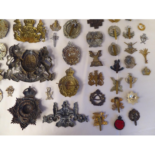 58 - Approx. fifty-five military cap badges and other insignia, some copies: to include Lowland Regiment;... 