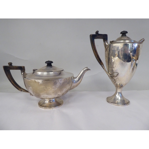 61 - An Edwardian four piece silver tea set of pedestal lamp design, comprising a teapot with a swept spo... 