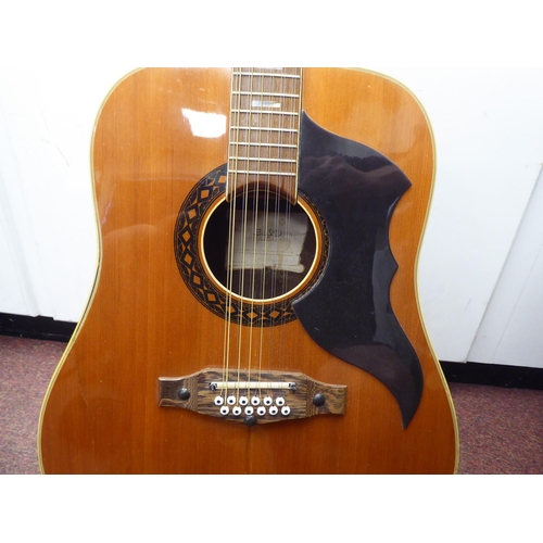 64 - An Eko Italian made, twelve string acoustic guitar with a stand and soft fabric case