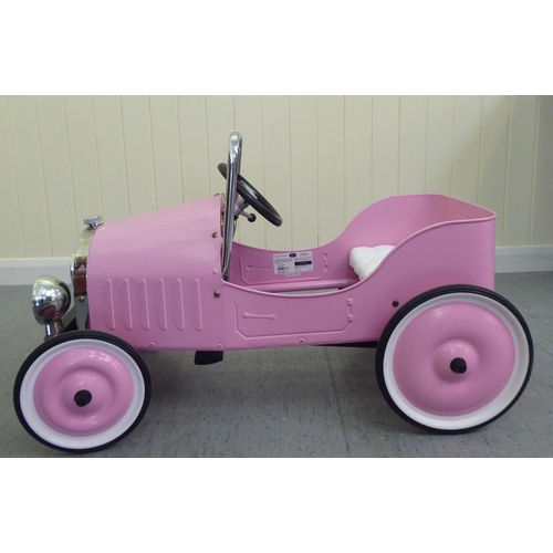 7 - A Baghera painted model pedal car, in pink livery with rubber wheels  32