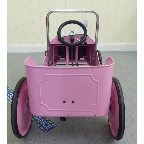 7 - A Baghera painted model pedal car, in pink livery with rubber wheels  32