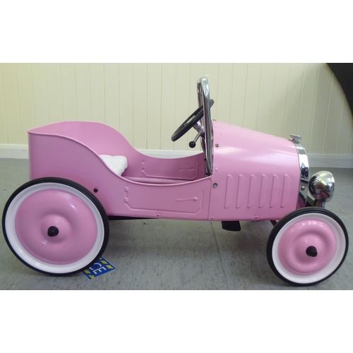 7 - A Baghera painted model pedal car, in pink livery with rubber wheels  32