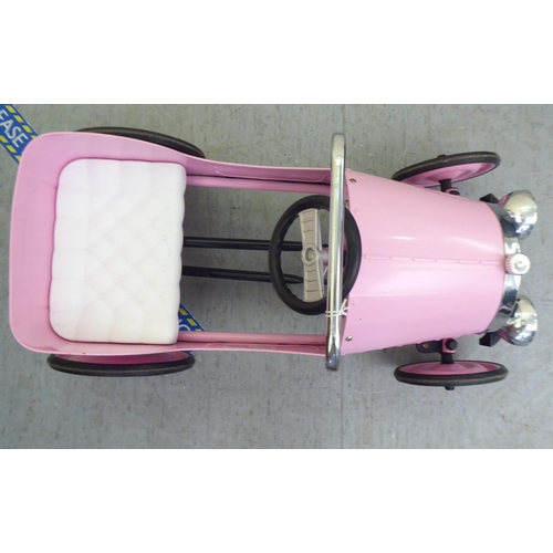 7 - A Baghera painted model pedal car, in pink livery with rubber wheels  32