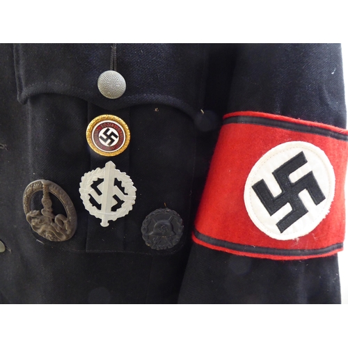 71 - A German World War II design SS military tunic with emblems and a peaked cap(Please Note: this lot i... 