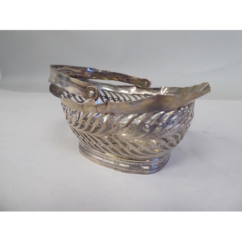 90 - Four similar 19thC Continental silver coloured metal miniature sweet baskets with variously ornament... 