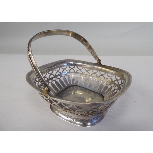 90 - Four similar 19thC Continental silver coloured metal miniature sweet baskets with variously ornament... 