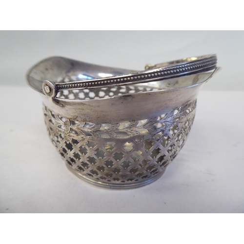 90 - Four similar 19thC Continental silver coloured metal miniature sweet baskets with variously ornament... 