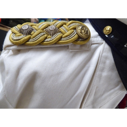 92 - A German World War II style Kreigsmarine tunic with emblems and a peak cap(Please Note: this lot is ... 