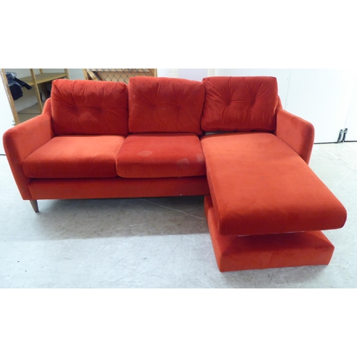 245 - A modern three person settee, upholstered in bright red fabric, raised on pegged feet  82