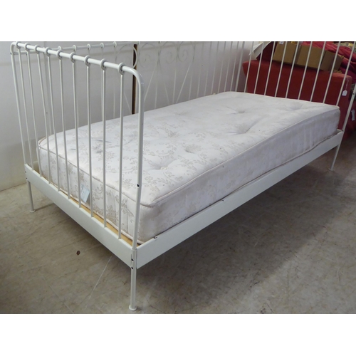 207 - A 20thC white painted tubular and C-scrolled metal framed three side open day bed  77