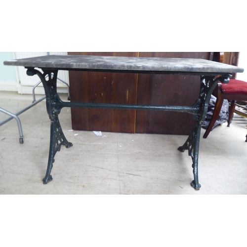 269 - A Victorian style cast iron terrace table base with a drop-in, weathered marble top  28