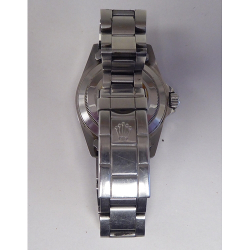 273 - A stainless steel cased and strapped automatic wristwatch, faced by a baton dial with a date apertur... 