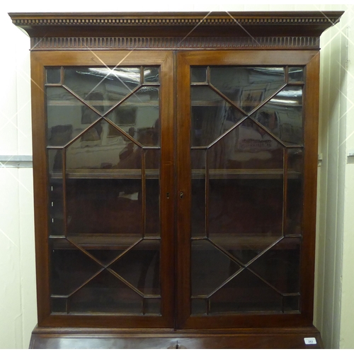 282 - A George III mahogany bureau bookcase with two astragal glazed doors, the fall flap over a drawer an... 