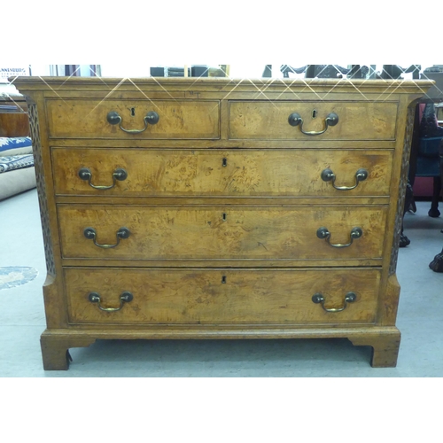 284 - A George II and later walnut and oak dressing chest with two short and three long drawers, flanked b... 