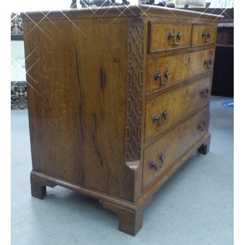 284 - A George II and later walnut and oak dressing chest with two short and three long drawers, flanked b... 