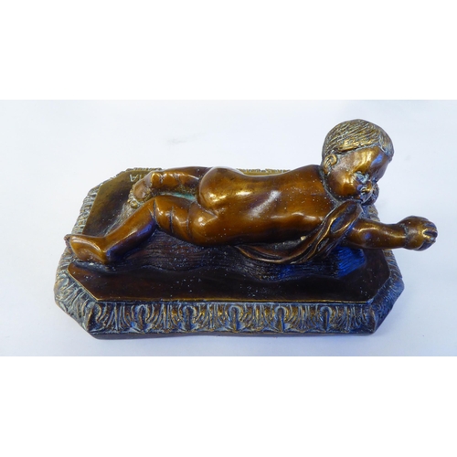 296 - A bronze, a crawling child, the plinth impressed 'Della Robbia'; a reproduction of an Art Deco bust ... 