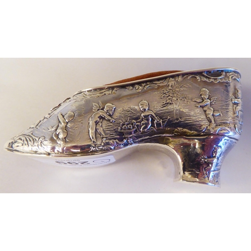 299 - A Dutch silver shoe design pin cushion