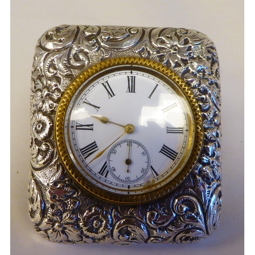 300 - A late Victorian silver cased travel timepiece, faced by a Roman dial with subsidiary seconds  ... 