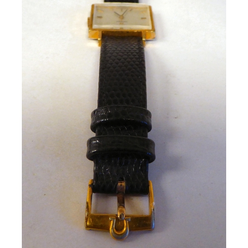 306 - An Omega gold plated and stainless steel cased wristwatch, the square baton dial, on a black hide sn... 