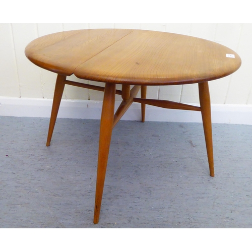 311 - A blonde Ercol elm drop leaf occasional table, raised on turned legs  16