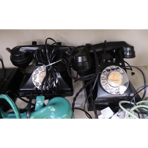 Vintage telephone handsets to include a turquoise coloured plastic