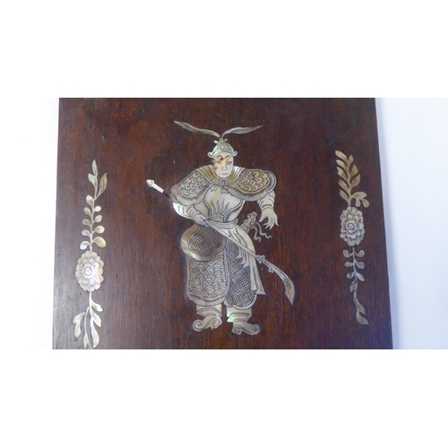 101 - A pair of Chinese hardwood panels, inlaid in engraved mother-of-pearl, depicting warriors bearing ar... 