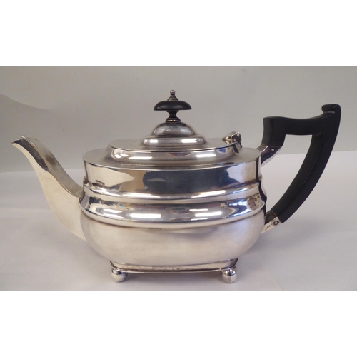 103 - A three piece bachelor's silver tea set of oval ogee form, comprising a teapot with a swept spout, i... 