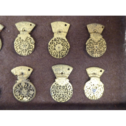 118 - A series of twelve 18th/19thC finely pierced and engraved gilt metal pocket watch balance cocks