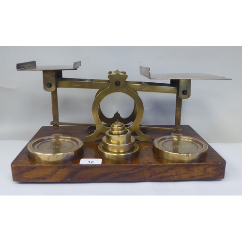 12 - Late Victorian S.Mordan & Co, London, lacquered brass beam balance postal scales, attached to an... 