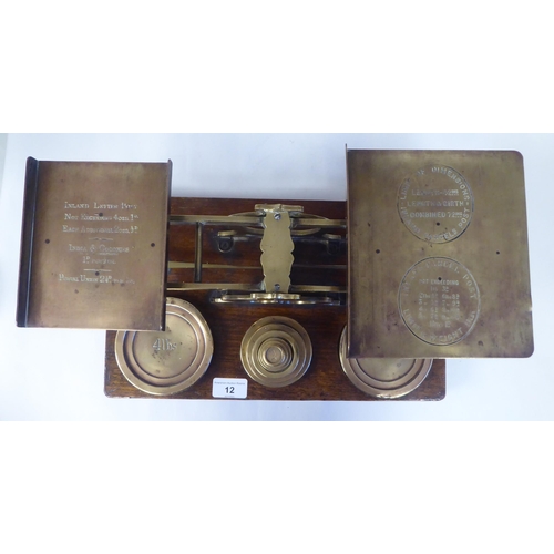 12 - Late Victorian S.Mordan & Co, London, lacquered brass beam balance postal scales, attached to an... 