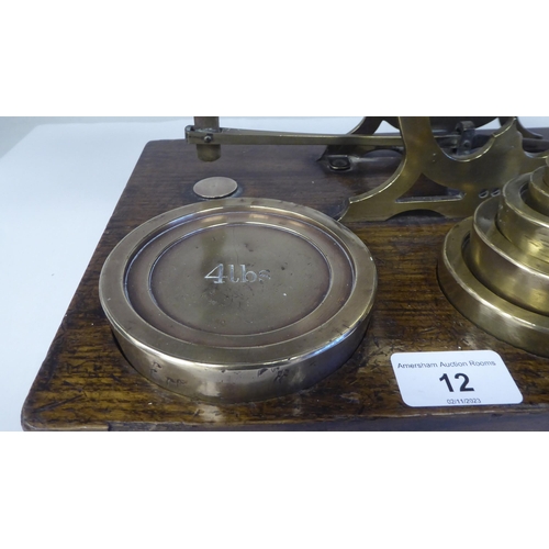 12 - Late Victorian S.Mordan & Co, London, lacquered brass beam balance postal scales, attached to an... 