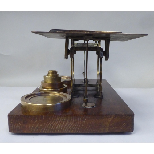 12 - Late Victorian S.Mordan & Co, London, lacquered brass beam balance postal scales, attached to an... 