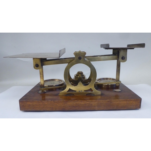 12 - Late Victorian S.Mordan & Co, London, lacquered brass beam balance postal scales, attached to an... 