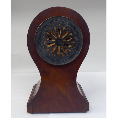 122 - A late Victorian/Edwardian string inlaid mahogany balloon cased mantel clock; the gong strike moveme... 