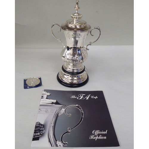 125 - A half-size silver replica of The Football Association Challenge Cup and cover with grape and vine d... 