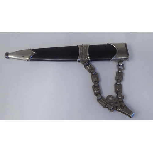 126 - A Third Reich era 'chained' SS dress dagger with a shaped handgrip, nickel-silver mounts and a cross... 