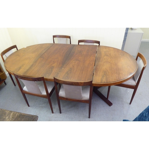 129 - A 1960s Danish Heltborg Mobler rosewood dining table with a two-part top, raised on an angled base  ... 