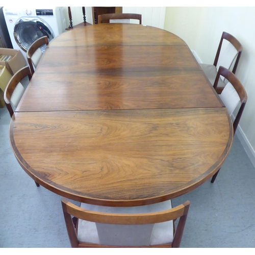 129 - A 1960s Danish Heltborg Mobler rosewood dining table with a two-part top, raised on an angled base  ... 