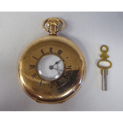 13 - A 9ct gold cased half-hunter pocket watch, the movement faced by a white enamel Roman dial, incorpor... 